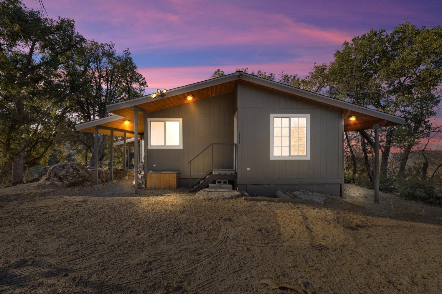 36696 Peterson Road Auberry, CA 93602 - Photo 23 of 34 a house with trees in the background
