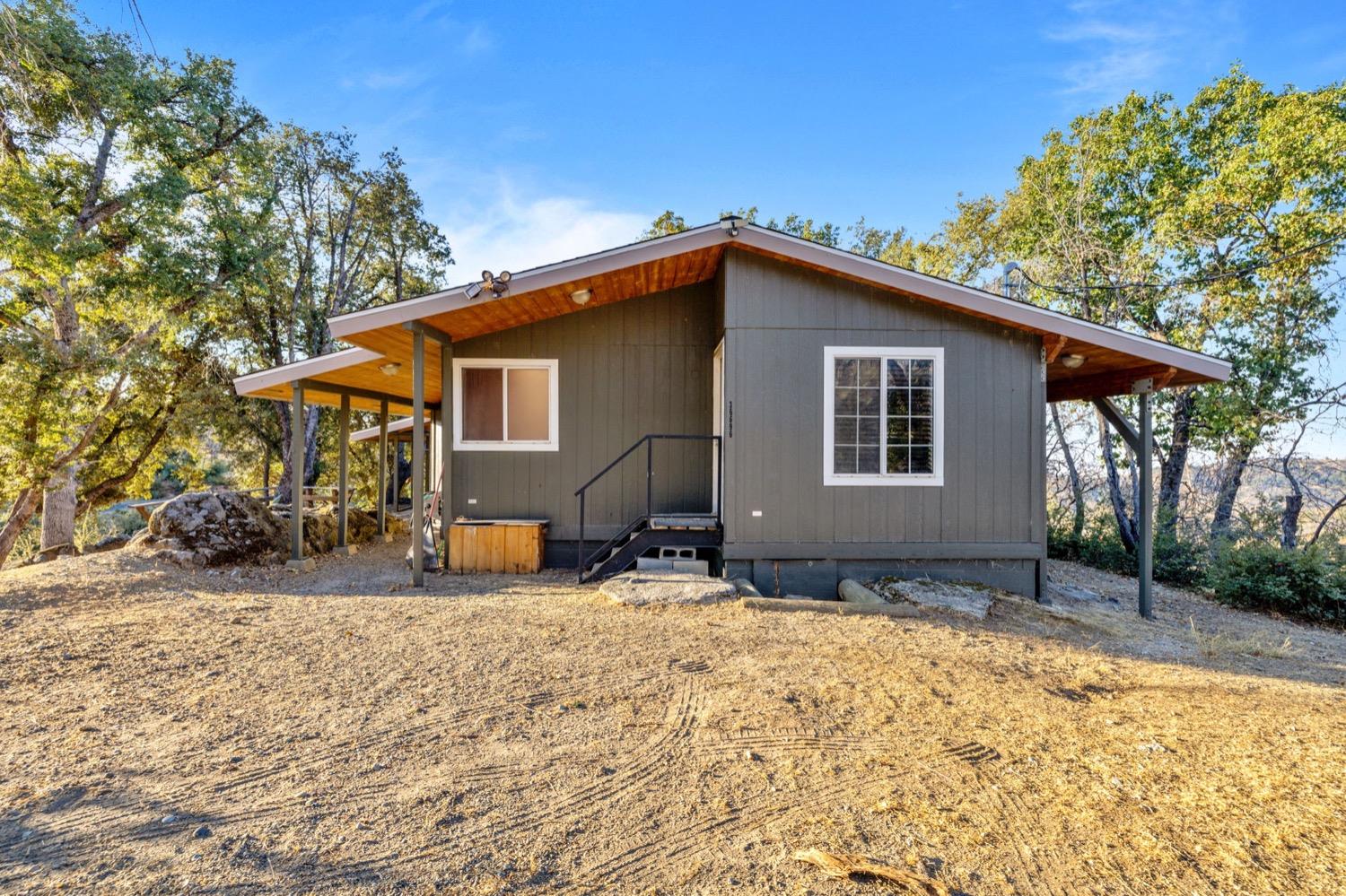 36696 Peterson Road Auberry, CA 93602 - Photo 24 of 34 a house with trees in the background
