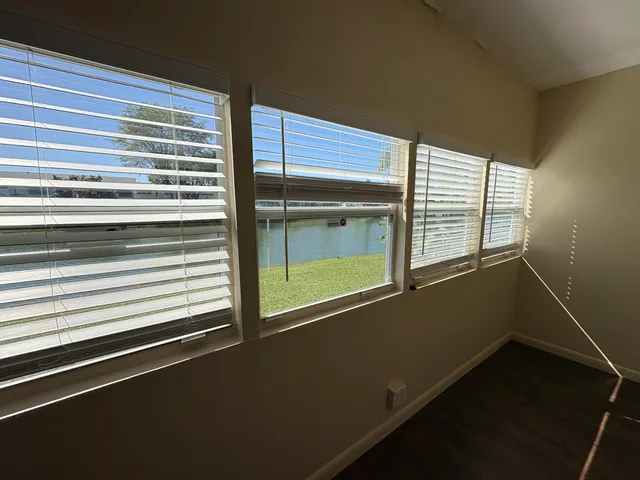 a view of a room that has a large window