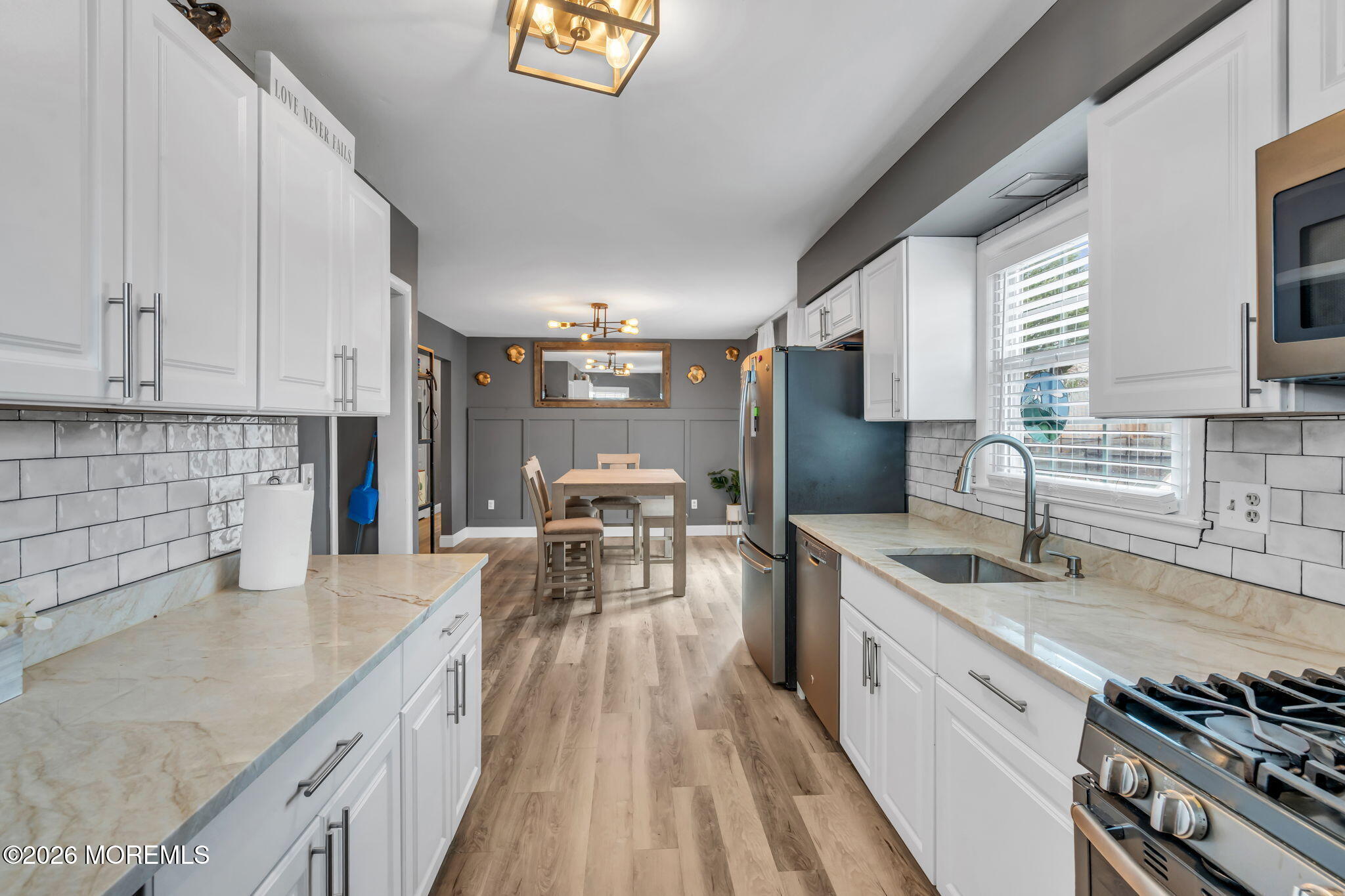 19 Virginia Drive Howell, NJ 07731 - Photo 17 of 39 a kitchen with stainless steel appliances granite countertop a sink stove and cabinets