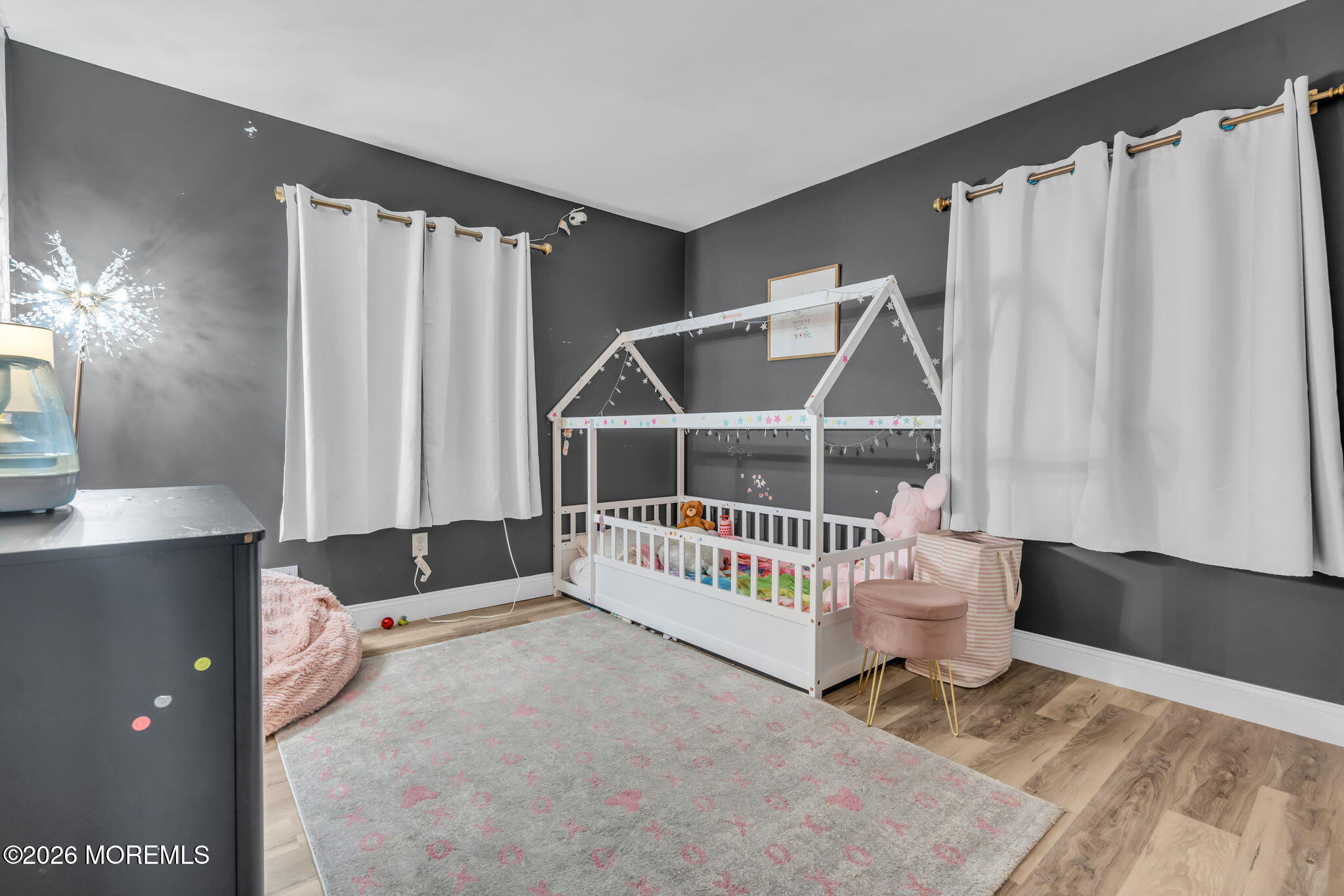 19 Virginia Drive Howell, NJ 07731 - Photo 22 of 39 a view of a livingroom with wooden floor and white walls