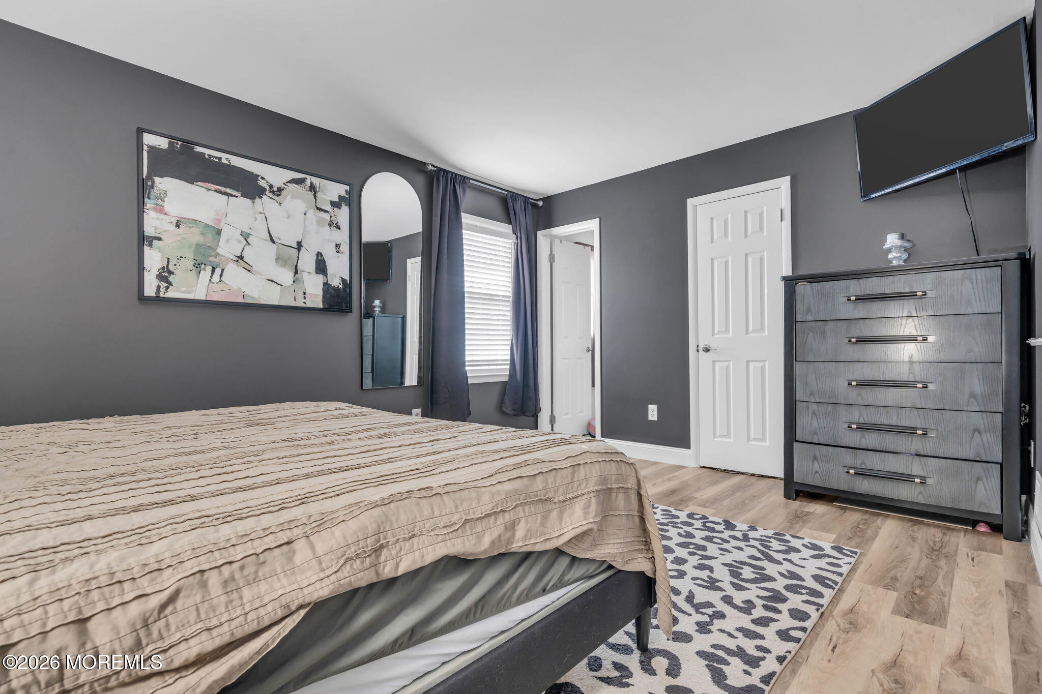 19 Virginia Drive Howell, NJ 07731 - Photo 25 of 39 a bedroom with a bed and a mirror