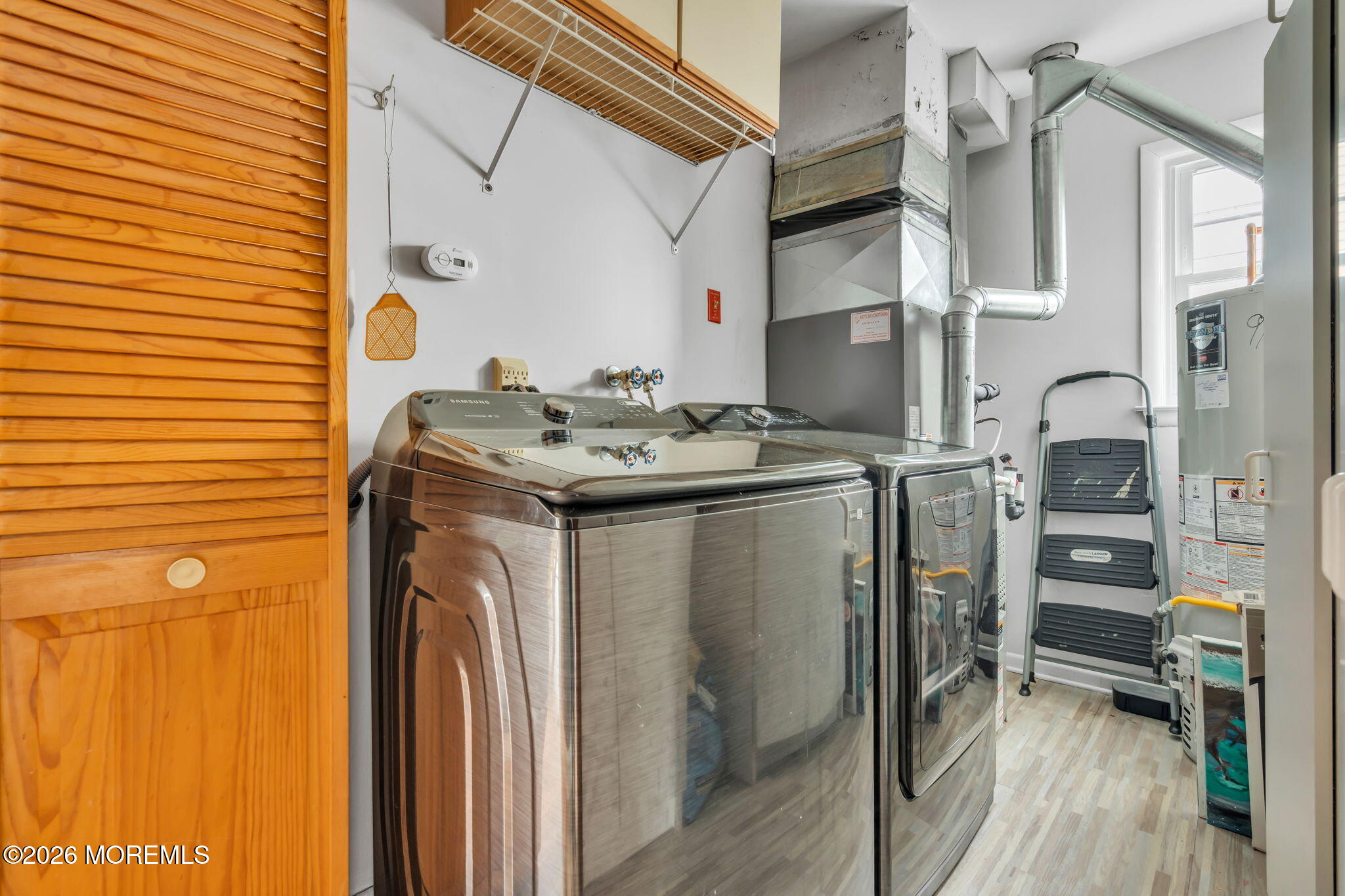 19 Virginia Drive Howell, NJ 07731 - Photo 29 of 39 a utility room with dryer and washer
