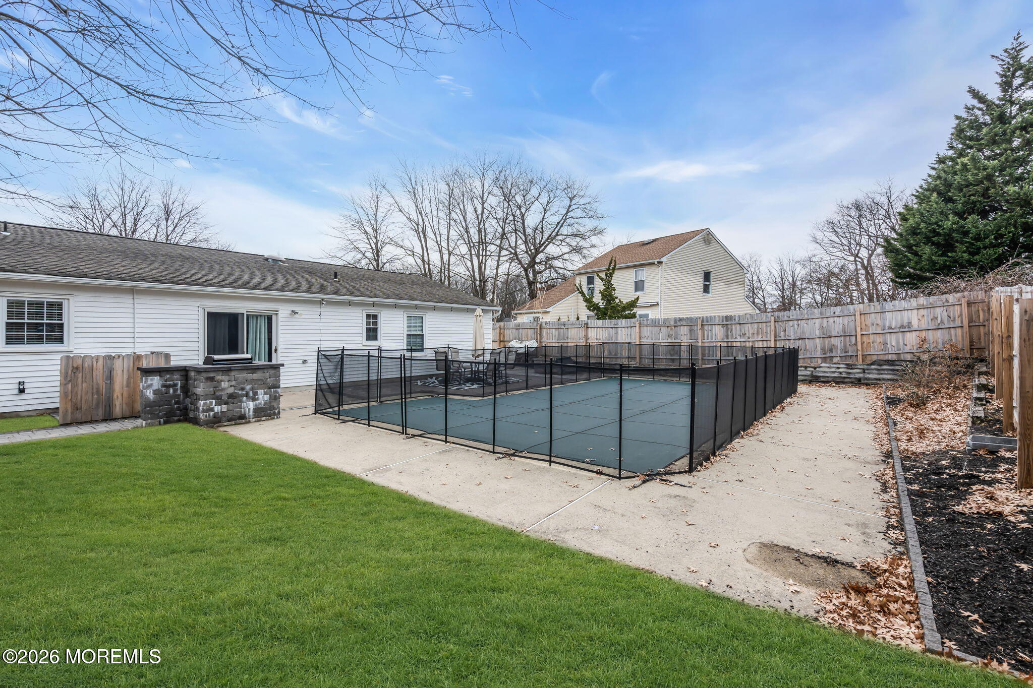 19 Virginia Drive Howell, NJ 07731 - Photo 32 of 39 a view of a backyard with a garden and tree