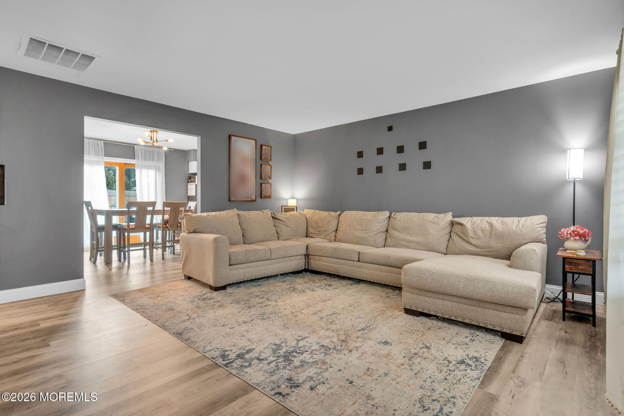 19 Virginia Drive Howell, NJ 07731 - Photo 8 of 39 a living room with furniture and a wooden floor