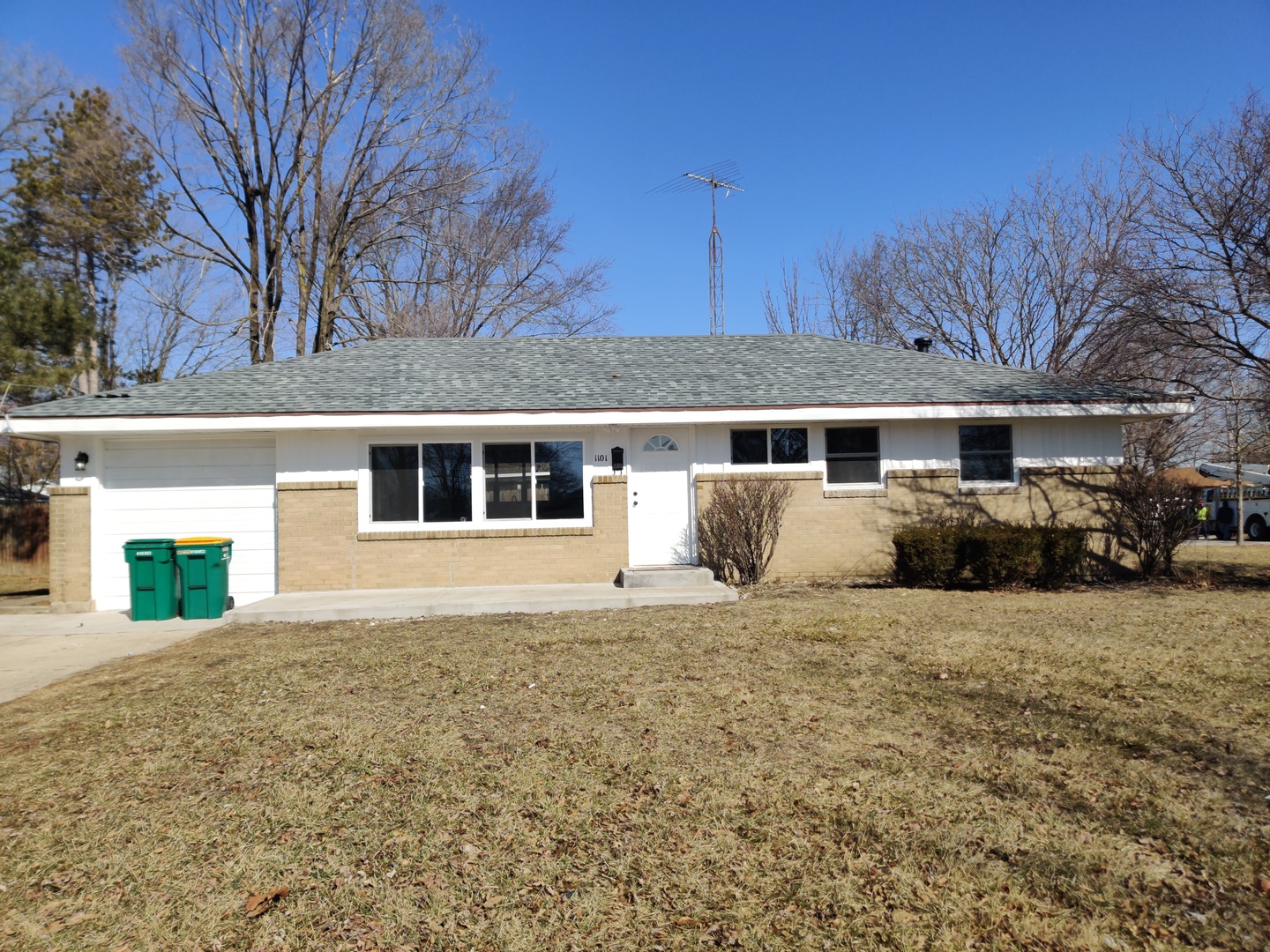 1101 Westminster Road Joliet, IL 60435 - Photo 1 of 17 a house that has a tree in front of it