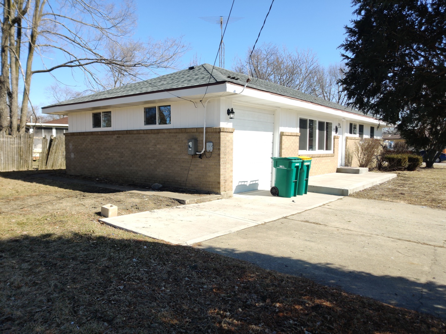 1101 Westminster Road Joliet, IL 60435 - Photo 16 of 17 a front view of a house with a yard