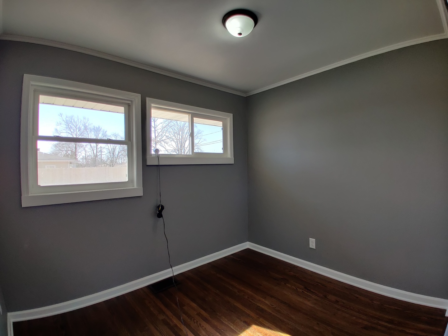 1101 Westminster Road Joliet, IL 60435 - Photo 5 of 17 a view of a room with wooden floor and windows