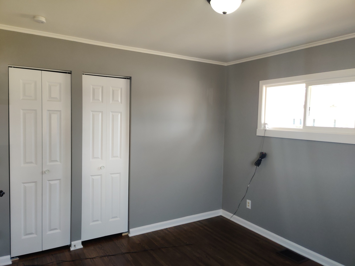 1101 Westminster Road Joliet, IL 60435 - Photo 6 of 17 an empty room with wooden floor and windows