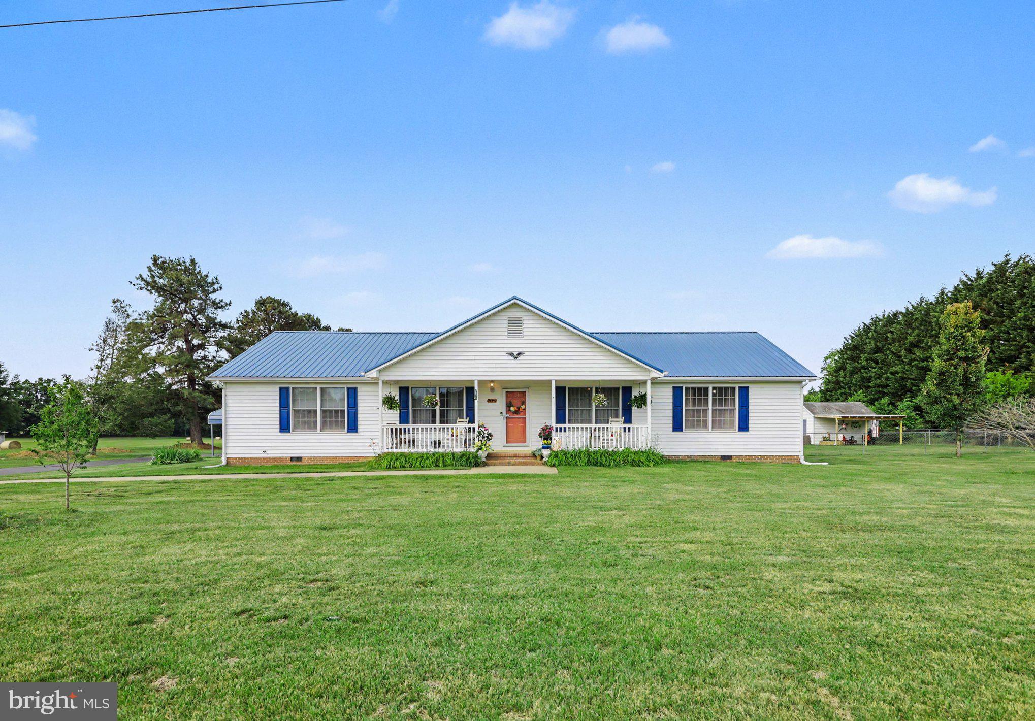 34340 Parker Road Locust Grove, VA 22508 - Photo 1 of 27 Charming home with lush green lawn.