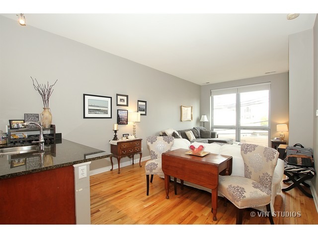 2025 South Indiana Avenue, Unit 211 Chicago, IL 60616 - Photo 5 of 10 a living room with furniture and a large window