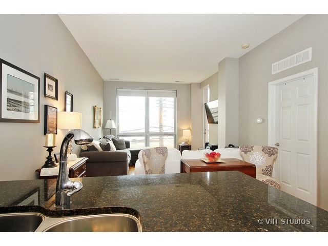2025 South Indiana Avenue, Unit 211 Chicago, IL 60616 - Photo 6 of 10 a living room with furniture and a large window
