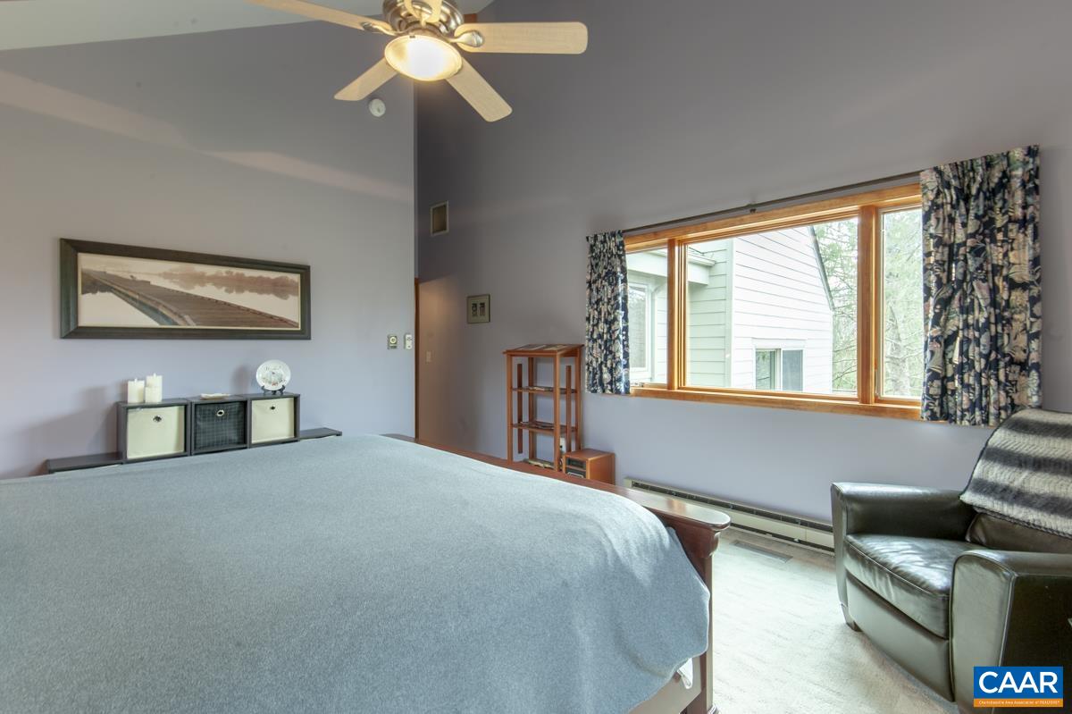 397 Rodes Valley Drive Nellysford, VA 22958 - Photo 28 of 46 a bedroom with furniture and a large window