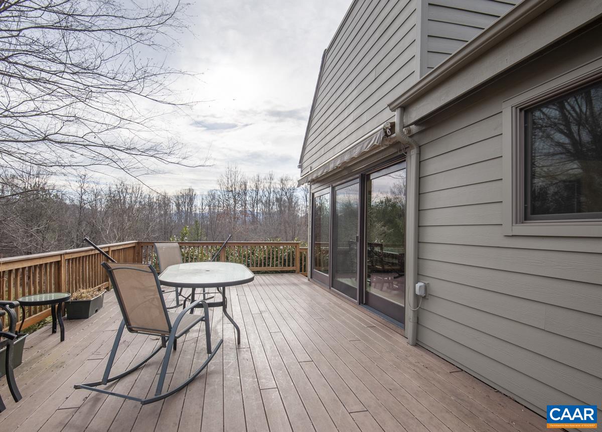 397 Rodes Valley Drive Nellysford, VA 22958 - Photo 35 of 46 a view of a chairs and table in the balcony