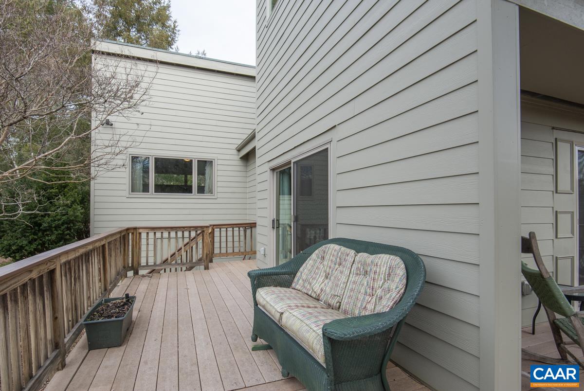 397 Rodes Valley Drive Nellysford, VA 22958 - Photo 38 of 46 a view of a chair and table in the balcony