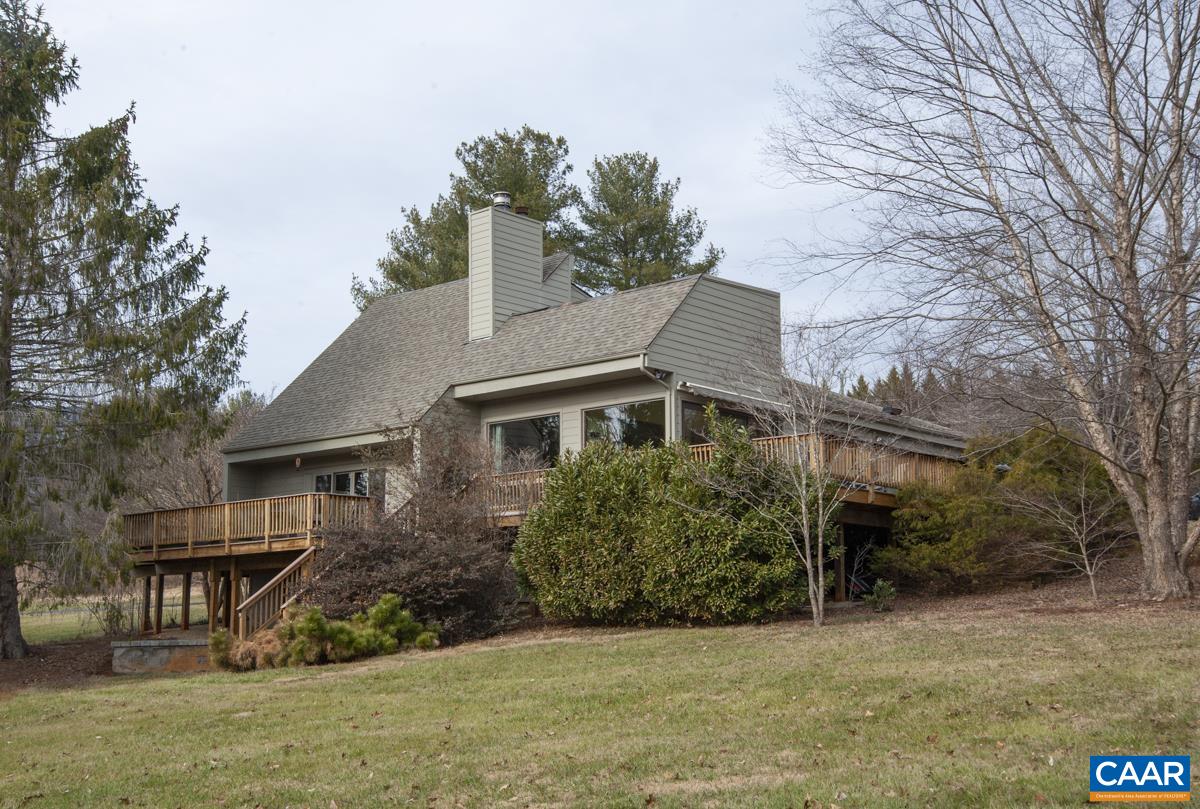 397 Rodes Valley Drive Nellysford, VA 22958 - Photo 43 of 46 a front view of a house with a garden