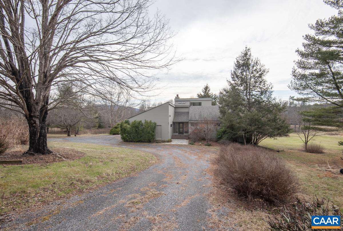 397 Rodes Valley Drive Nellysford, VA 22958 - Photo 6 of 46 a view of a dirt road with a building