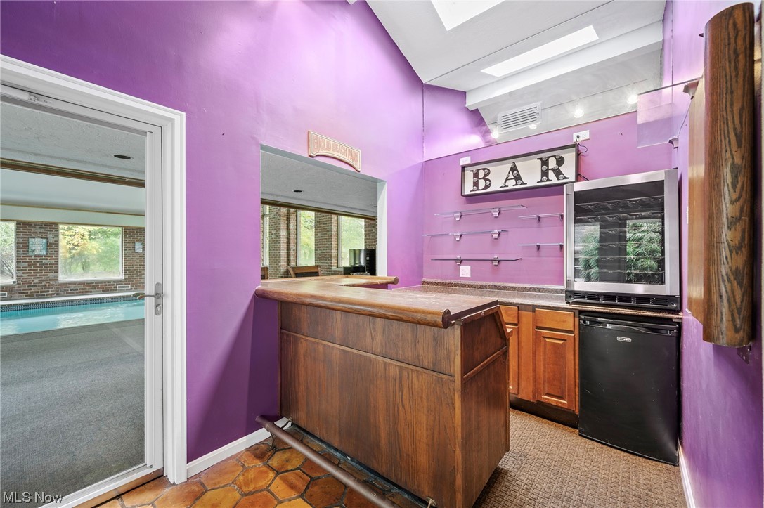 29475 Bolingbrook Road Pepper Pike, OH 44124 - Photo 25 of 49 Wet bar with fridge in the breezeway, adjacent to the pool room.