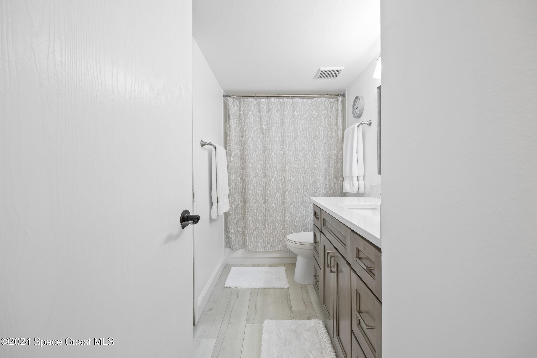 7030 N Highway, Unit DD205 Cocoa, FL 32927 - Photo 17 of 34 a bathroom with a sink a toilet and shower