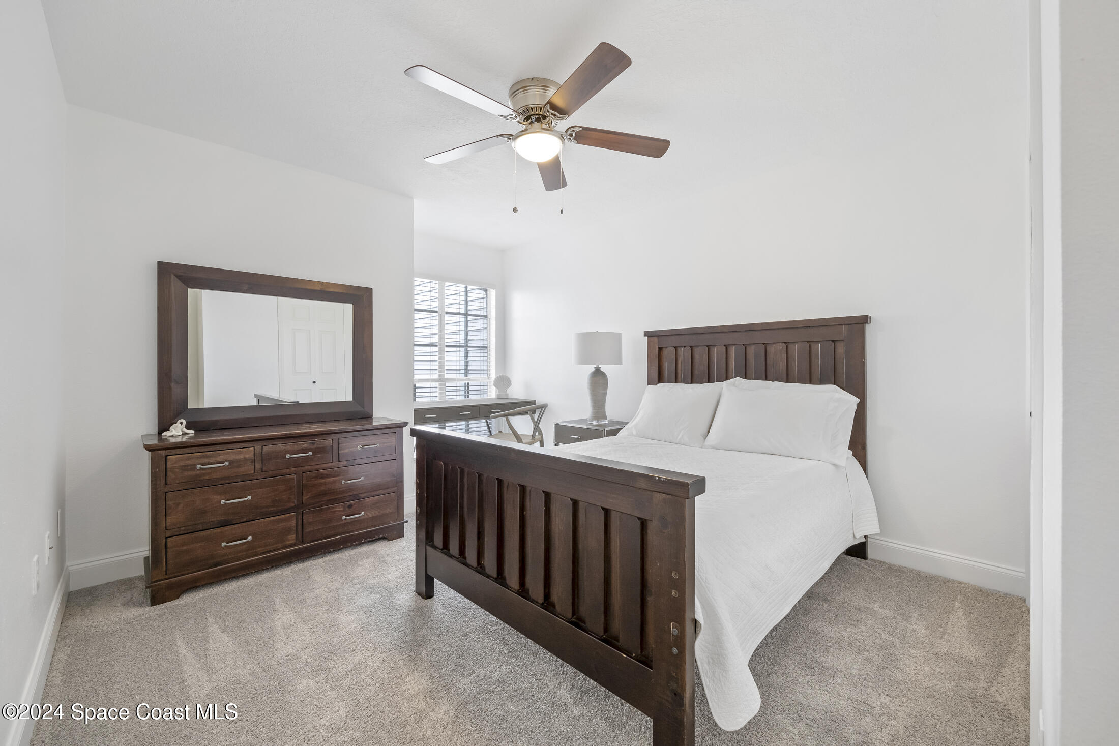 7030 N Highway, Unit DD205 Cocoa, FL 32927 - Photo 19 of 34 a bedroom with a bed and window