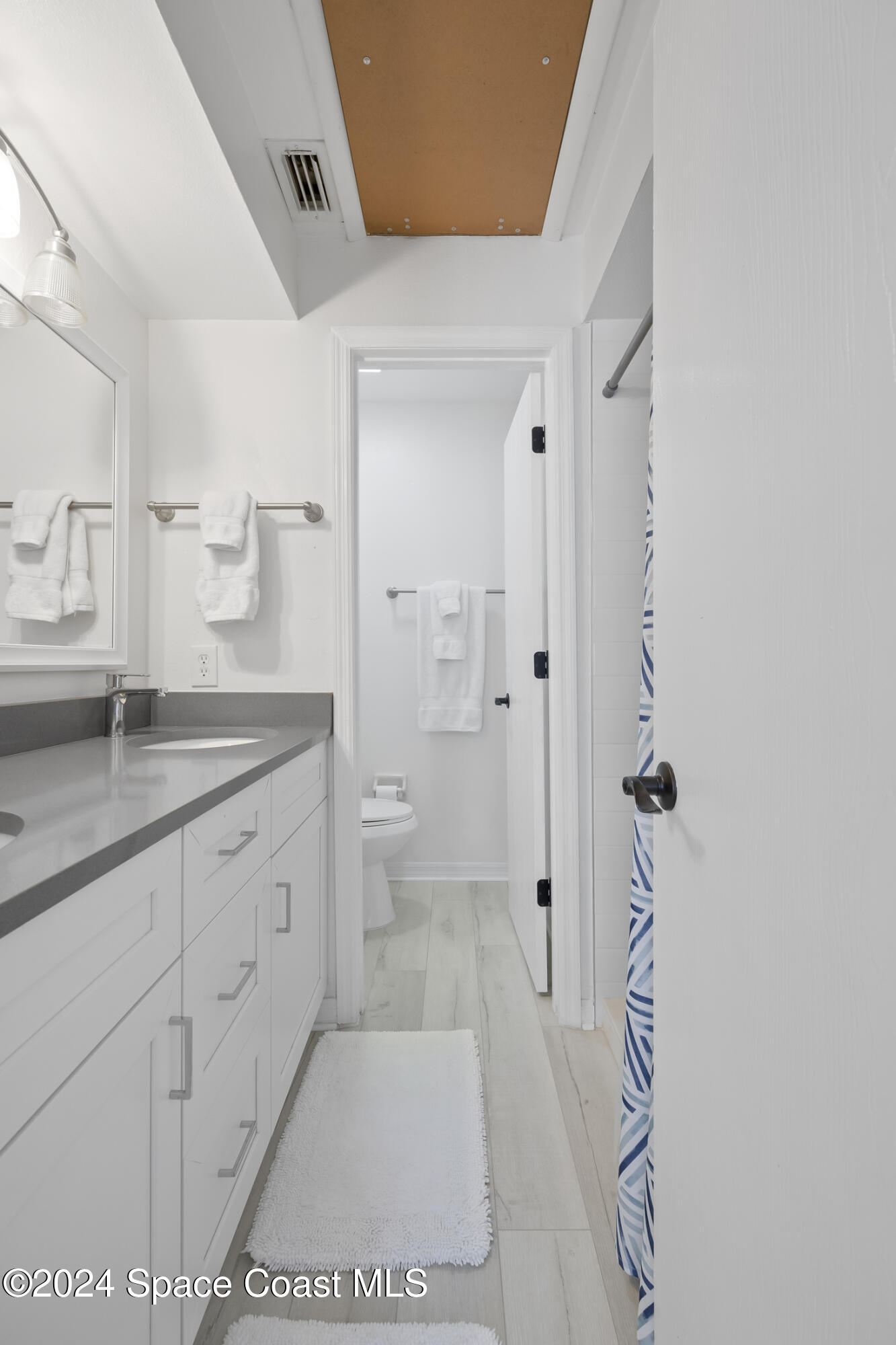 7030 N Highway, Unit DD205 Cocoa, FL 32927 - Photo 24 of 34 a spacious bathroom with a granite countertop sink a toilet and shower