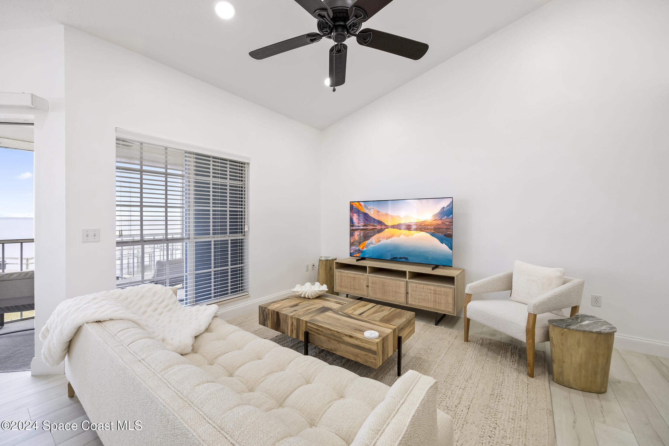 7030 N Highway, Unit DD205 Cocoa, FL 32927 - Photo 7 of 34 a living room with furniture and a window