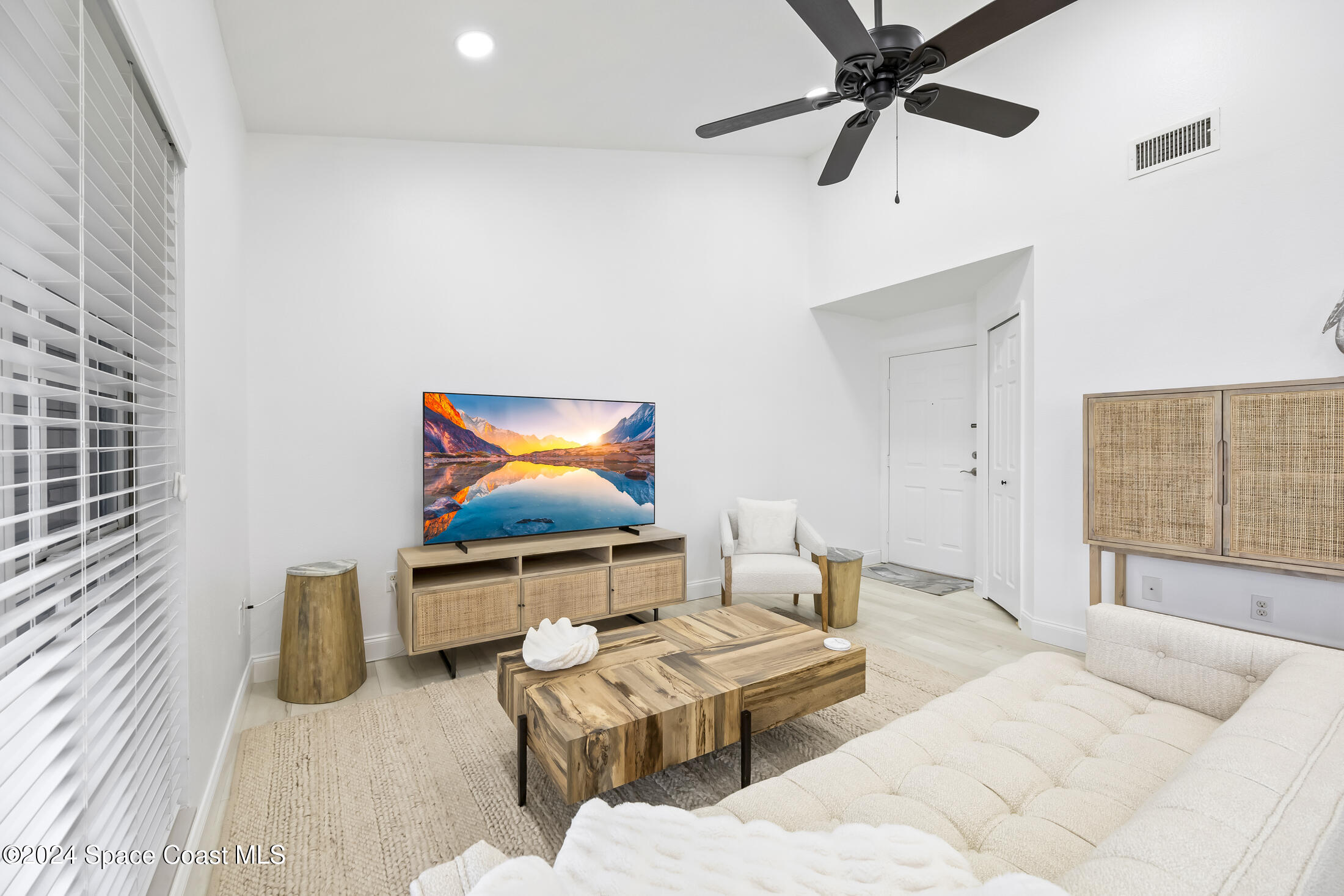 7030 N Highway, Unit DD205 Cocoa, FL 32927 - Photo 8 of 34 a bedroom with furniture and a flat screen tv