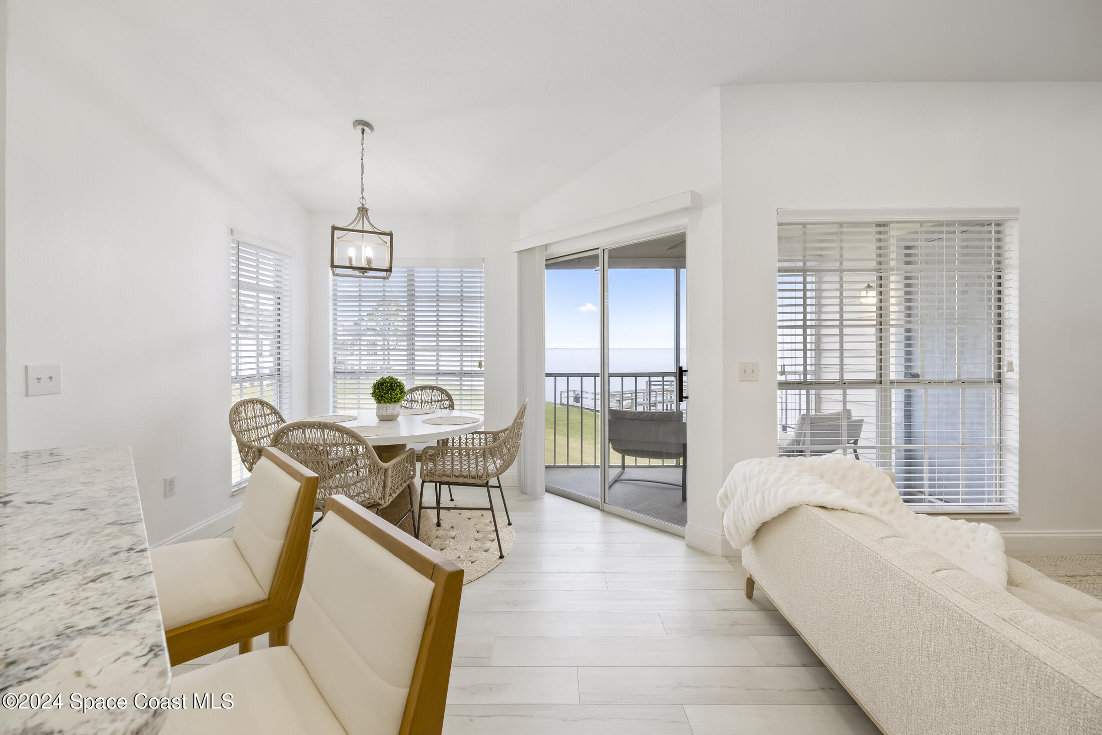 7030 N Highway, Unit DD205 Cocoa, FL 32927 - Photo 9 of 34 a living room with furniture a window and wooden floor