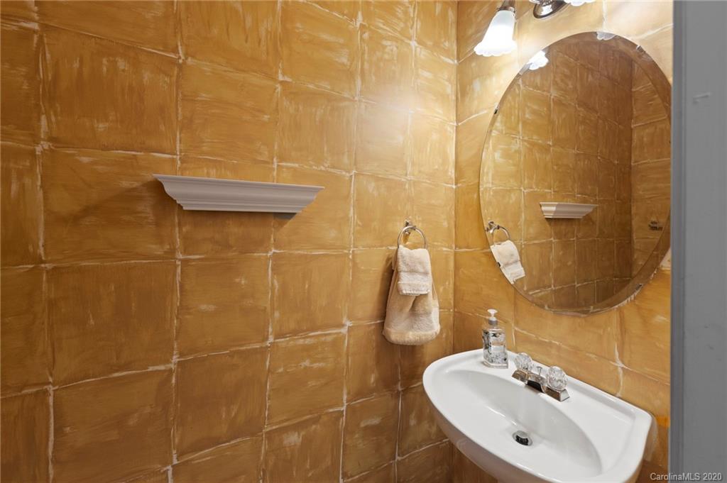2511 Fossil Stone Lane Fort Mill, SC 29708 - Photo 20 of 34 a bathroom with a sink shower and a mirror