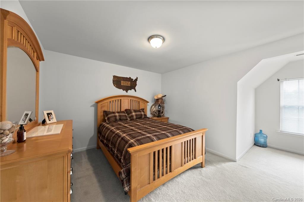 2511 Fossil Stone Lane Fort Mill, SC 29708 - Photo 21 of 34 a bedroom with bed and a window