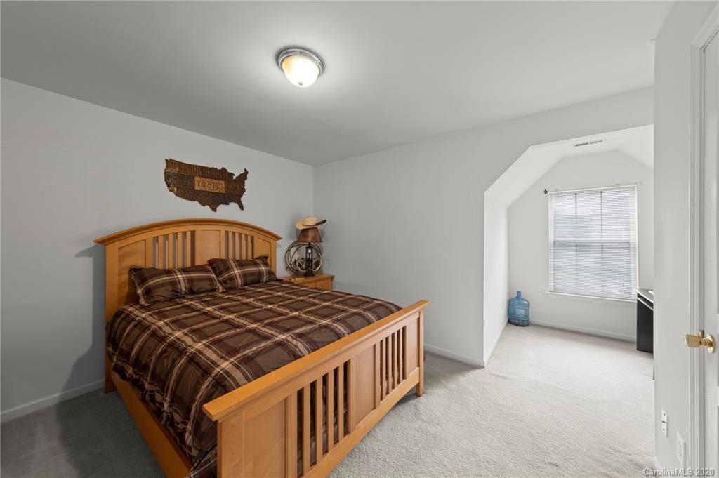 2511 Fossil Stone Lane Fort Mill, SC 29708 - Photo 22 of 34 a bedroom with a bed and window
