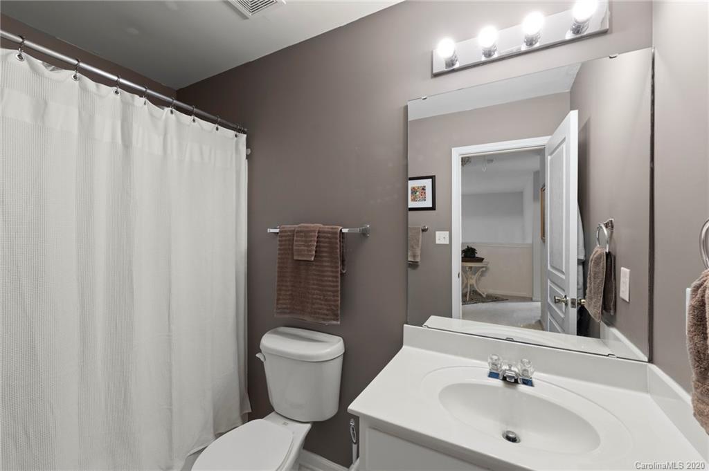 2511 Fossil Stone Lane Fort Mill, SC 29708 - Photo 24 of 34 a bathroom with a sink toilet and shower