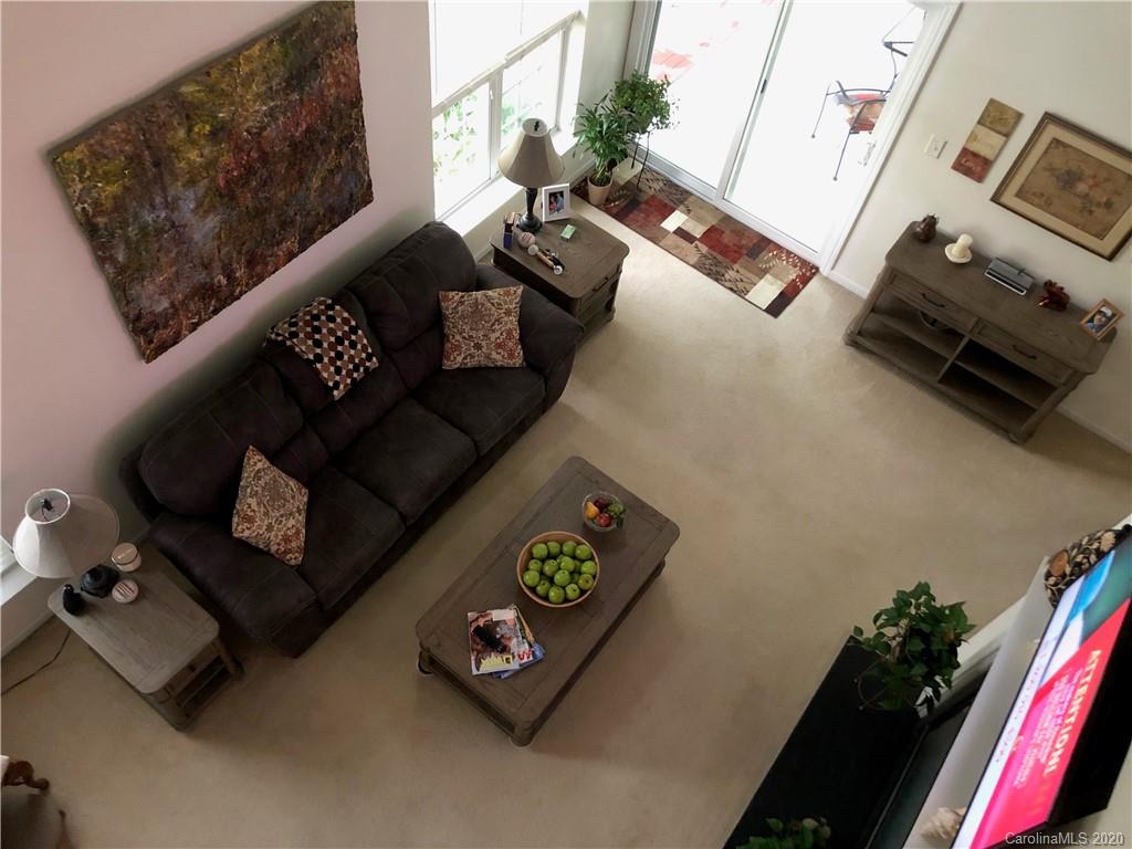 2511 Fossil Stone Lane Fort Mill, SC 29708 - Photo 8 of 34 a living room with furniture and flowers