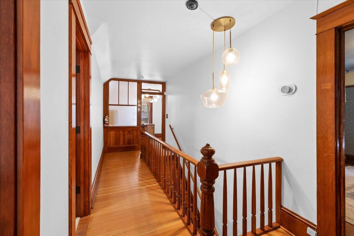 139 Southwest I Street Grants Pass, OR 97526 - Photo 29 of 47 a view of a hallway with wooden floor and staircase