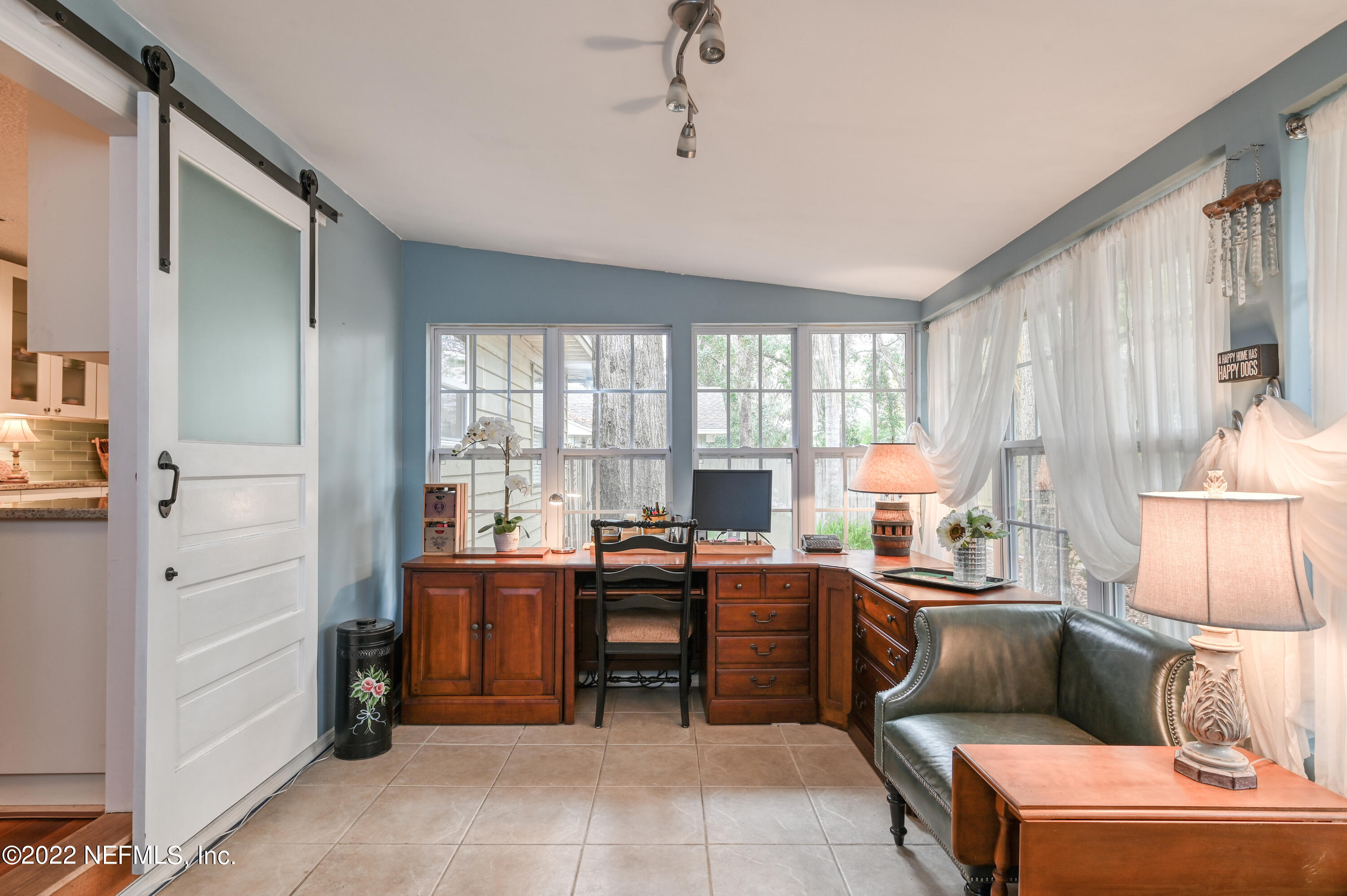 513 Jasmine Road St. Augustine, FL 32086 - Photo 14 of 37 a room with furniture a large window and a table