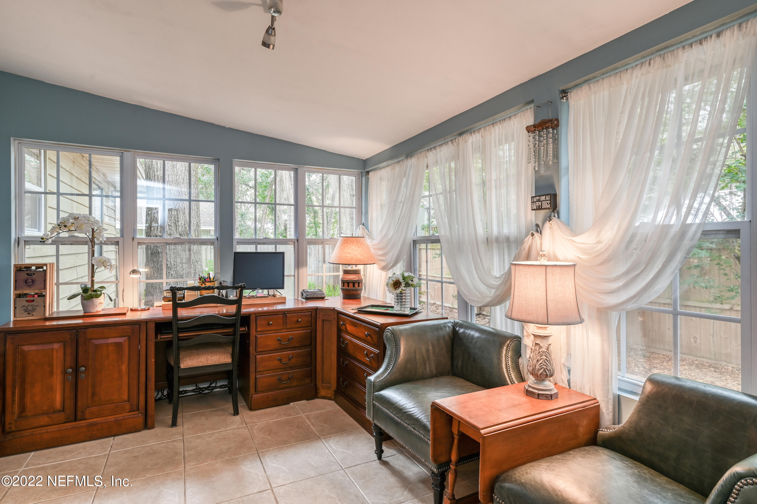 513 Jasmine Road St. Augustine, FL 32086 - Photo 15 of 37 a room with furniture a large window and a table