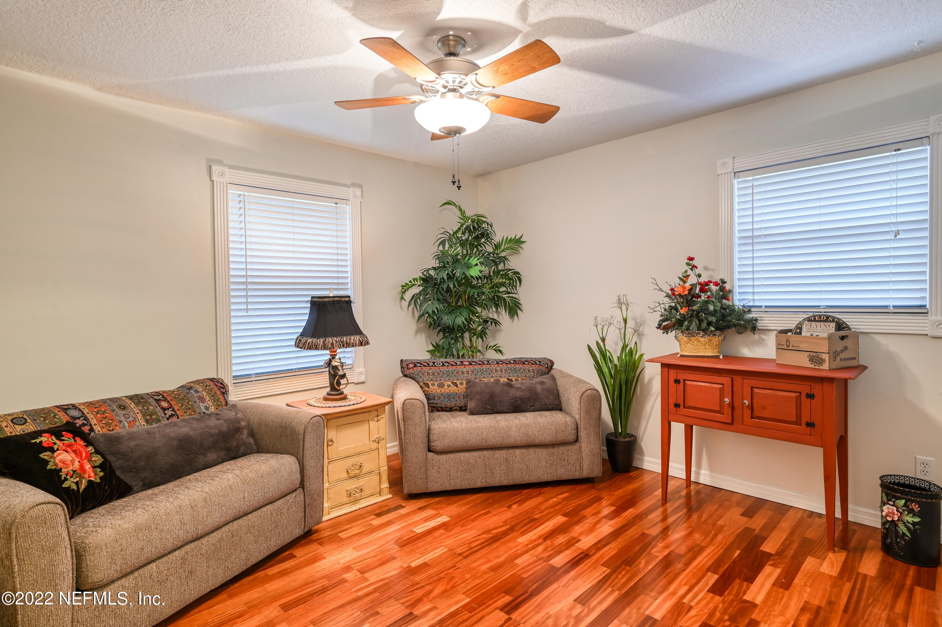 513 Jasmine Road St. Augustine, FL 32086 - Photo 20 of 37 a living room with furniture and a chandelier