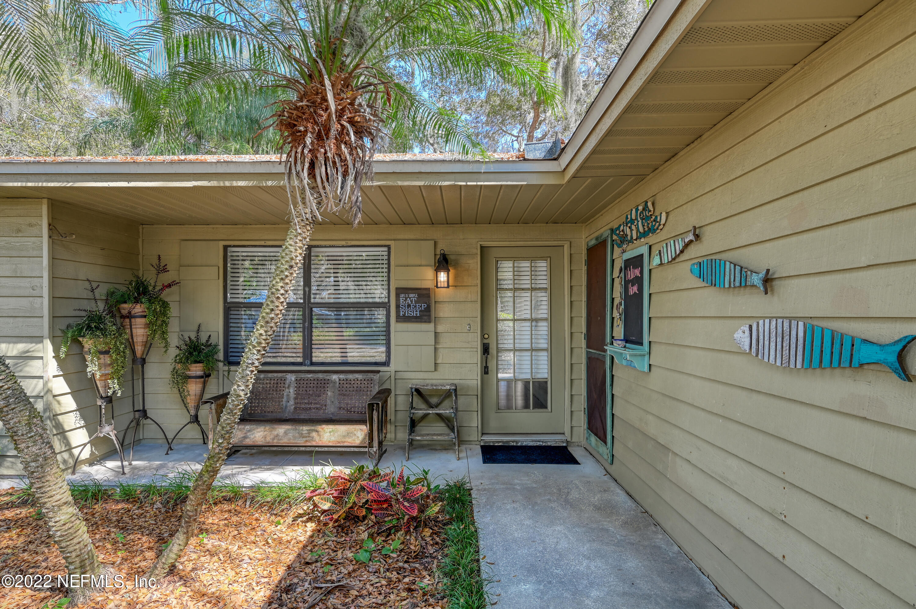 513 Jasmine Road St. Augustine, FL 32086 - Photo 5 of 37 a front view of a house with a garden