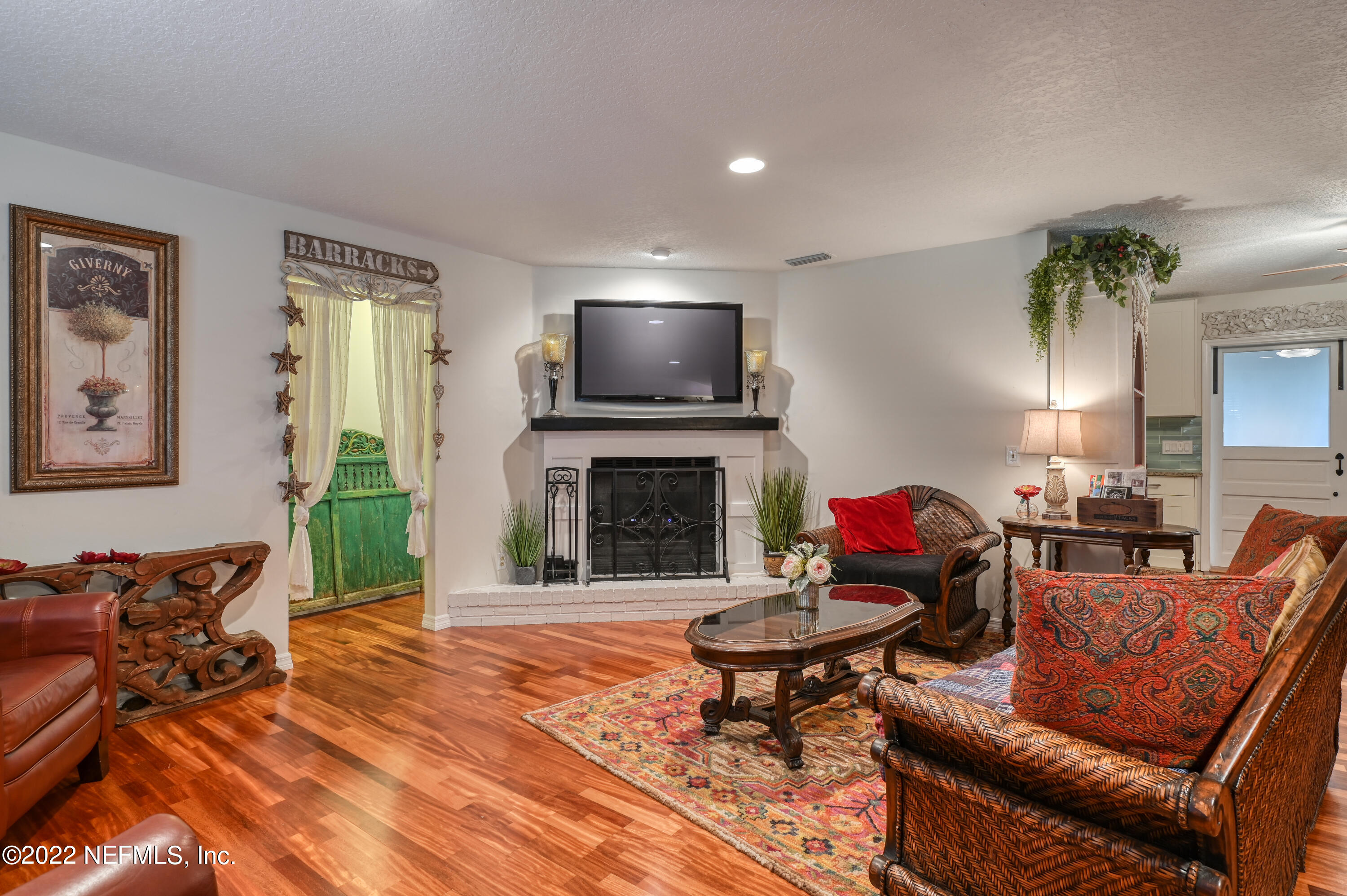 513 Jasmine Road St. Augustine, FL 32086 - Photo 7 of 37 a living room with furniture and a fireplace