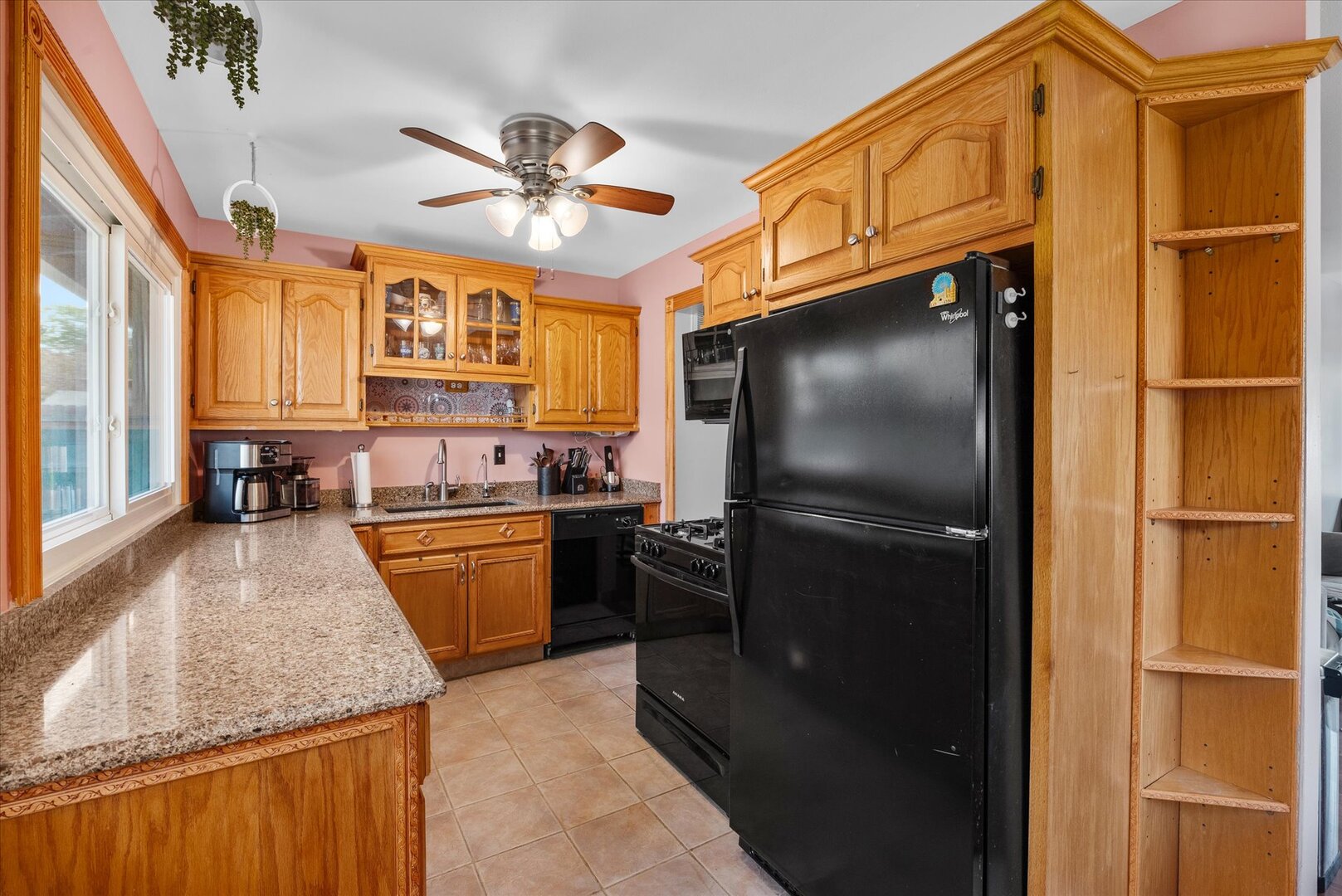 14 Hampton Road Montgomery, IL 60538 - Photo 17 of 27 a kitchen with stainless steel appliances granite countertop a refrigerator a stove and a sink with dishwasher