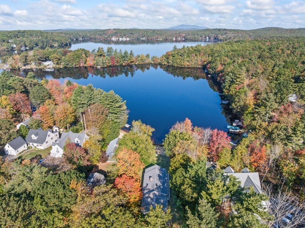 6 Winding Cove Road Ashburnham, MA 01430 - Photo 2 of 40 a view of a lake with mountains in the background