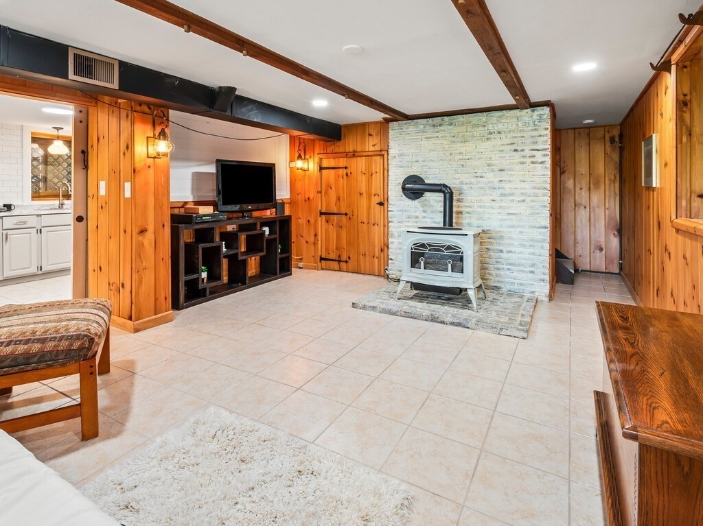 6 Winding Cove Road Ashburnham, MA 01430 - Photo 24 of 40 a living room with furniture and a flat screen tv