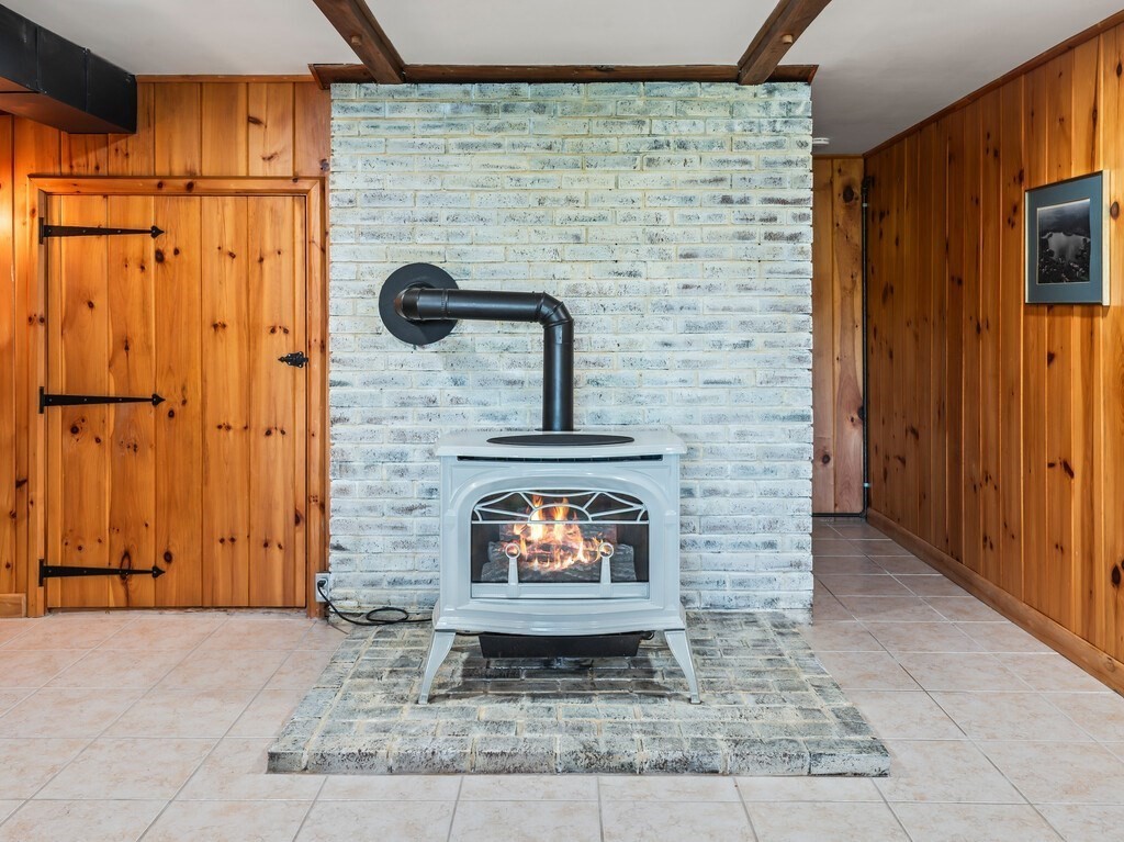 6 Winding Cove Road Ashburnham, MA 01430 - Photo 25 of 40 a view of a fireplace in an empty room