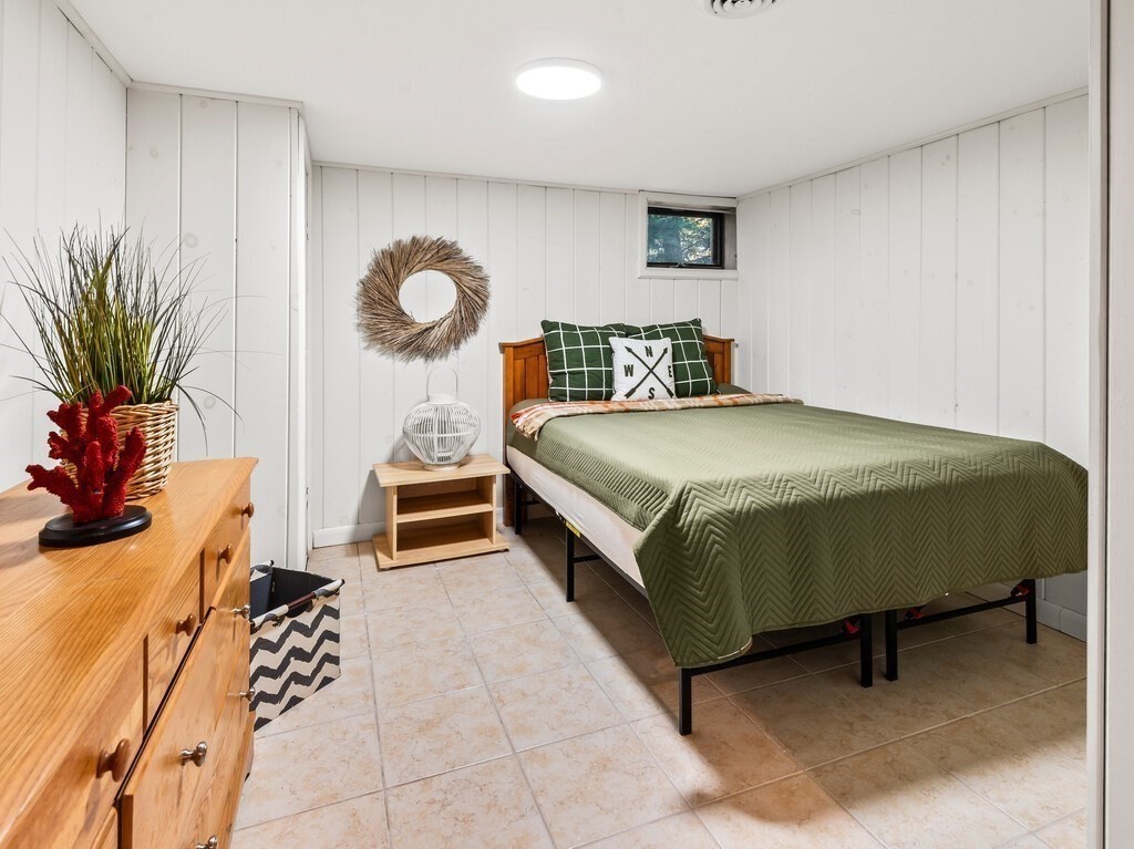 6 Winding Cove Road Ashburnham, MA 01430 - Photo 32 of 40 a bedroom with a bed and a potted plant