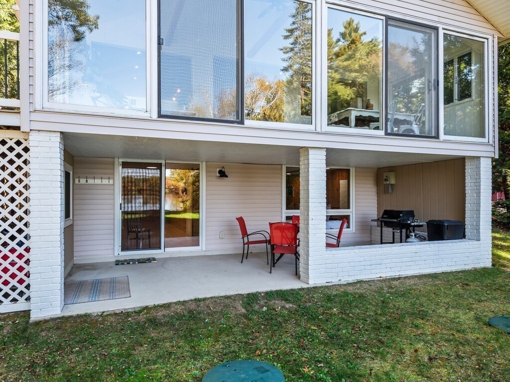 6 Winding Cove Road Ashburnham, MA 01430 - Photo 35 of 40 a view of a house with a backyard and sitting area