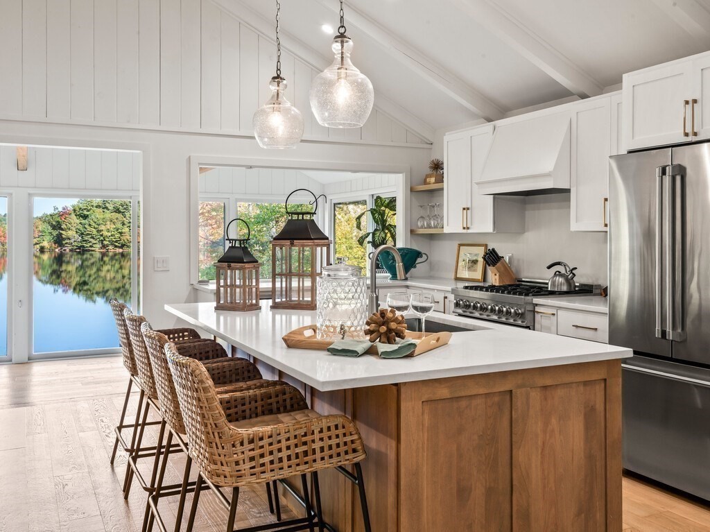 6 Winding Cove Road Ashburnham, MA 01430 - Photo 7 of 40 a dining room with furniture a chandelier and kitchen view