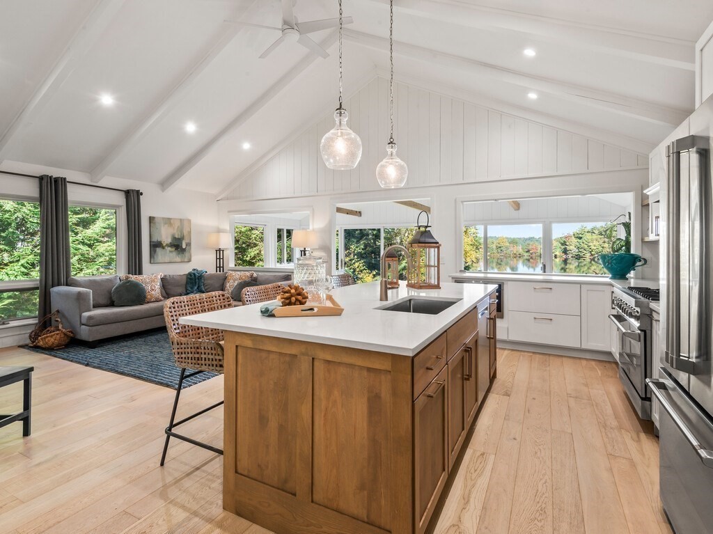 6 Winding Cove Road Ashburnham, MA 01430 - Photo 8 of 40 a kitchen with kitchen island a large counter space a sink appliances and windows