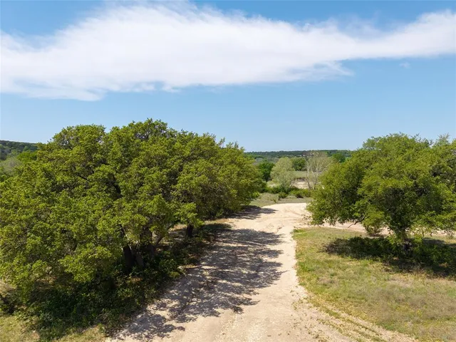 a view of a pathway with a ocean view