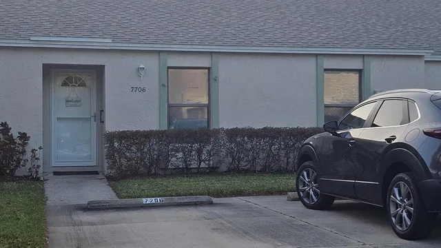 a car parked in front of a house