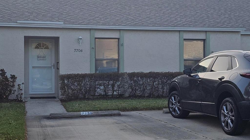 a car parked in front of a house